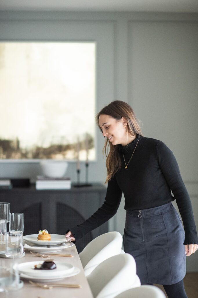 White Table Catering staff placing a plate at the table