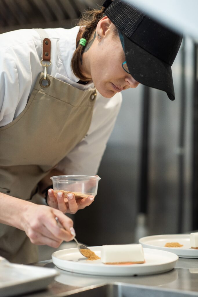 White Table catering chef preparing a plated dessert